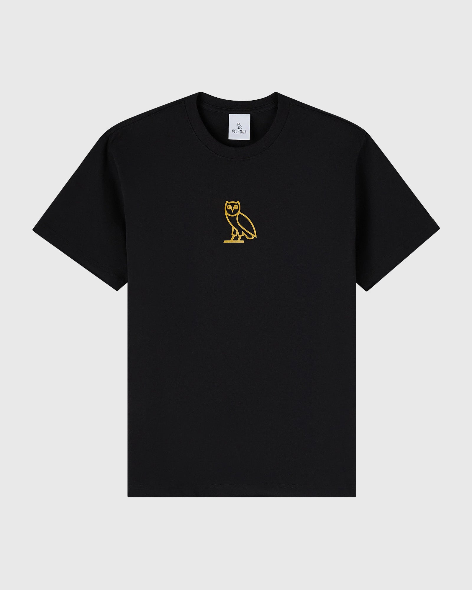 Black crew neck t-shirt with small gold owl emblem on chest.