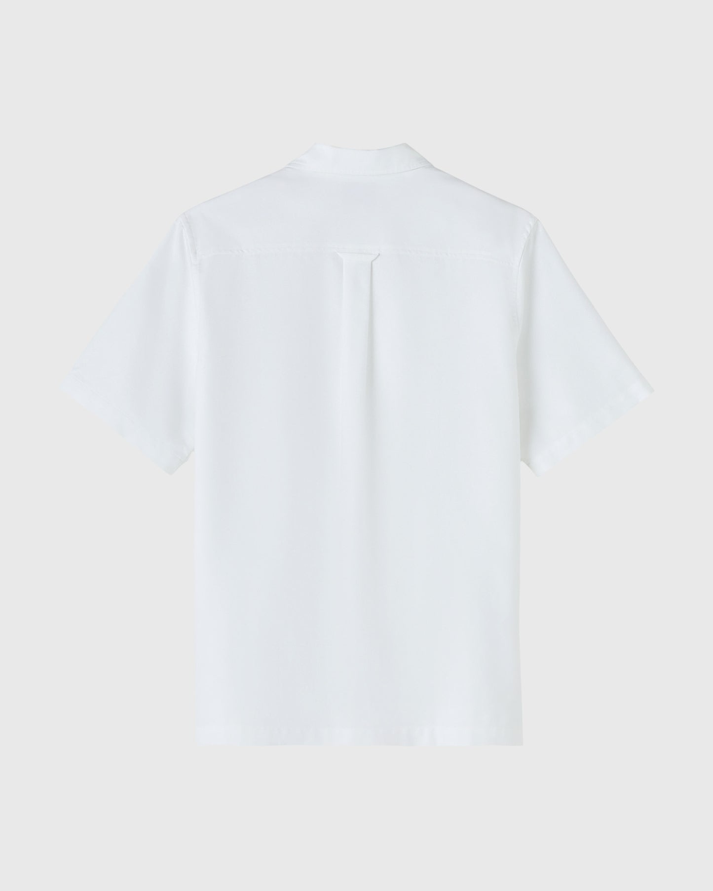 White short-sleeve camp shirt with button front and chest pocket, displayed flat against neutral background.