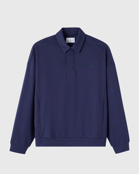 Dark blue rugby polo shirt with embroidered script text on chest, collared neckline, and long sleeves.