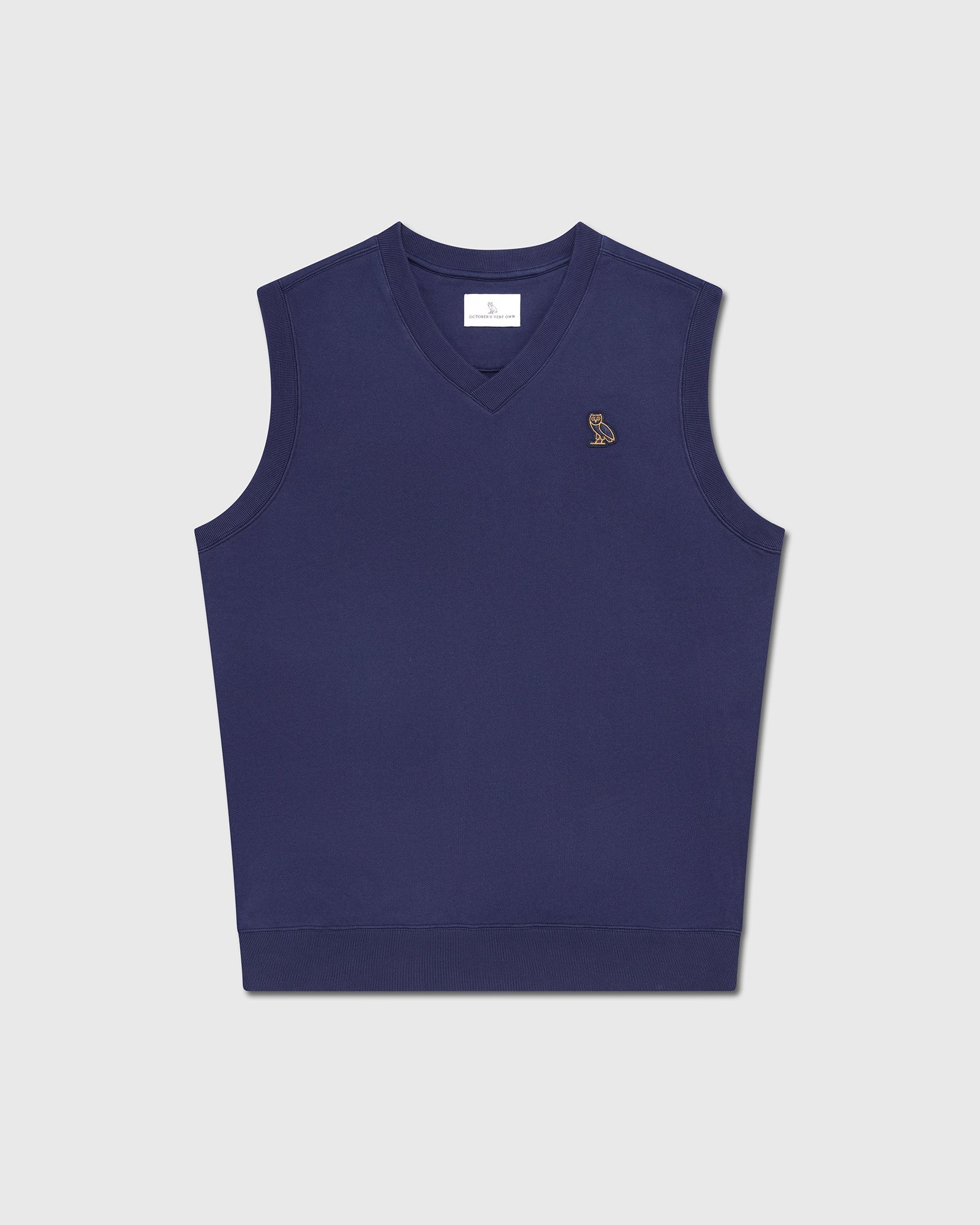 Navy blue sleeveless vest with V-neckline and small embroidered logo on chest.