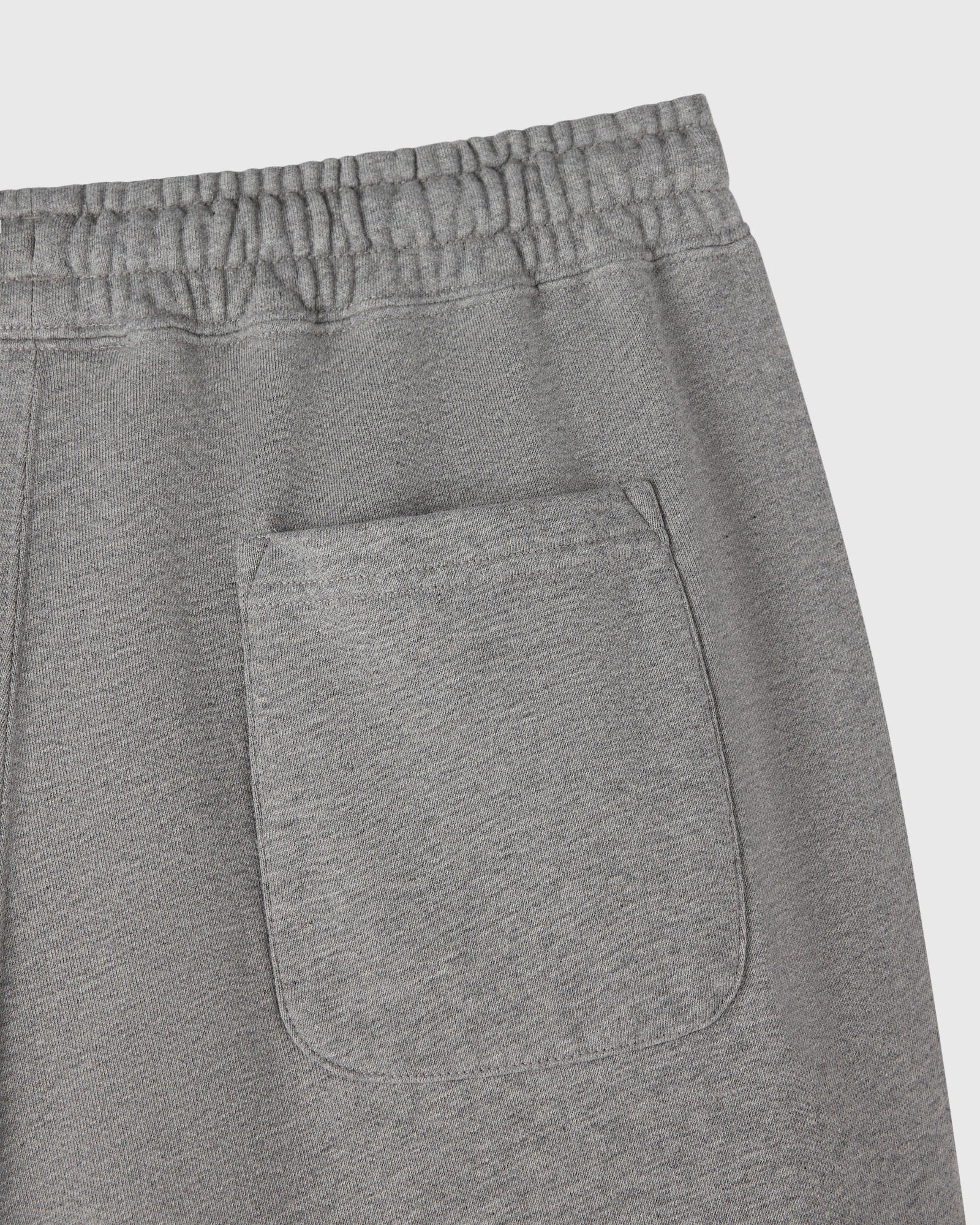 Heather grey sweatpant with elastic waistband and front patch pocket.