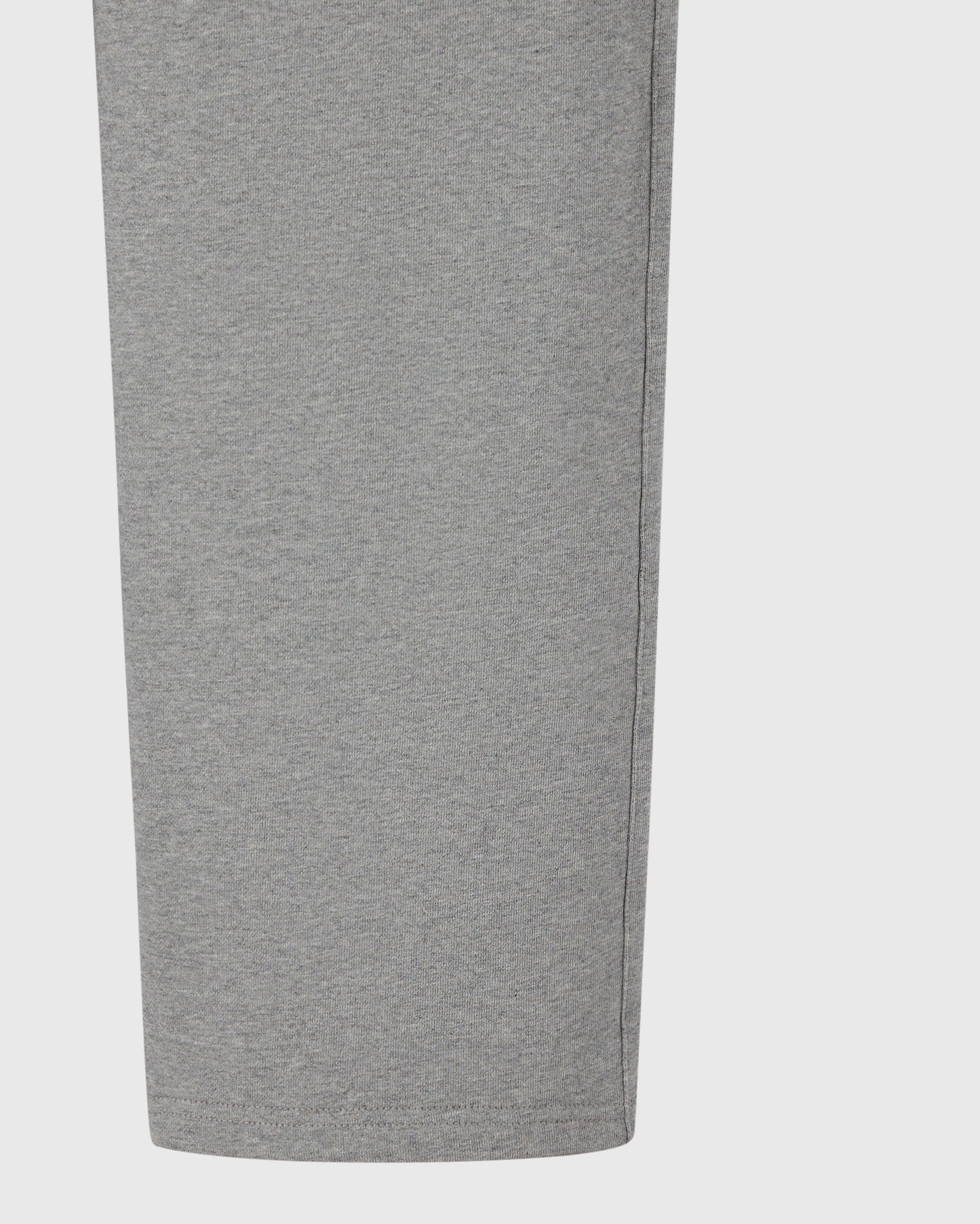 Heather grey sweatpant with open hem and ribbed waistband shown from the side.