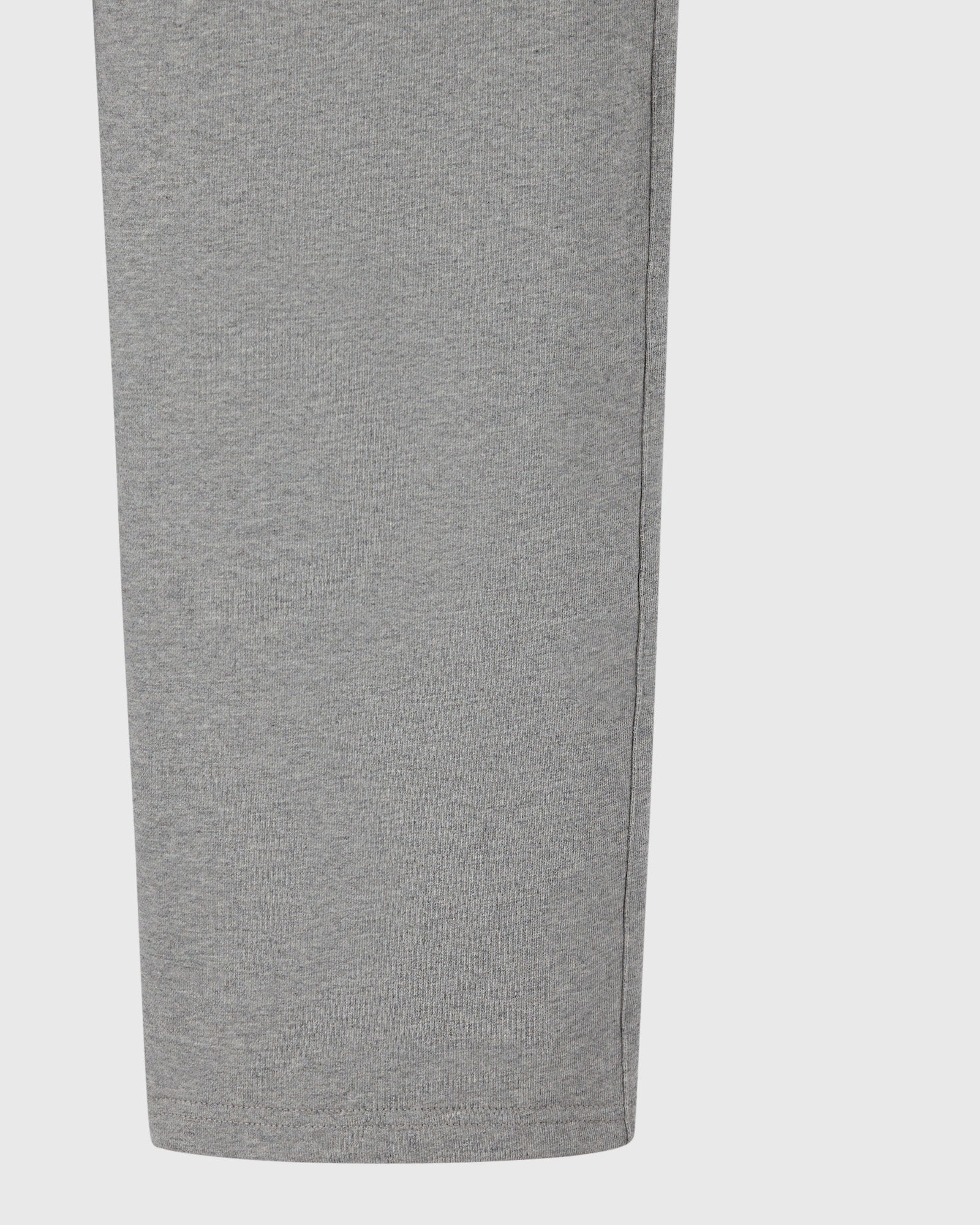 Heather grey sweatpant with open hem and ribbed waistband shown from the side.