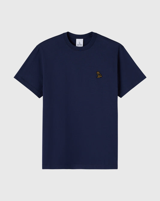 Navy short-sleeve t-shirt with small gold owl embroidery on chest.
