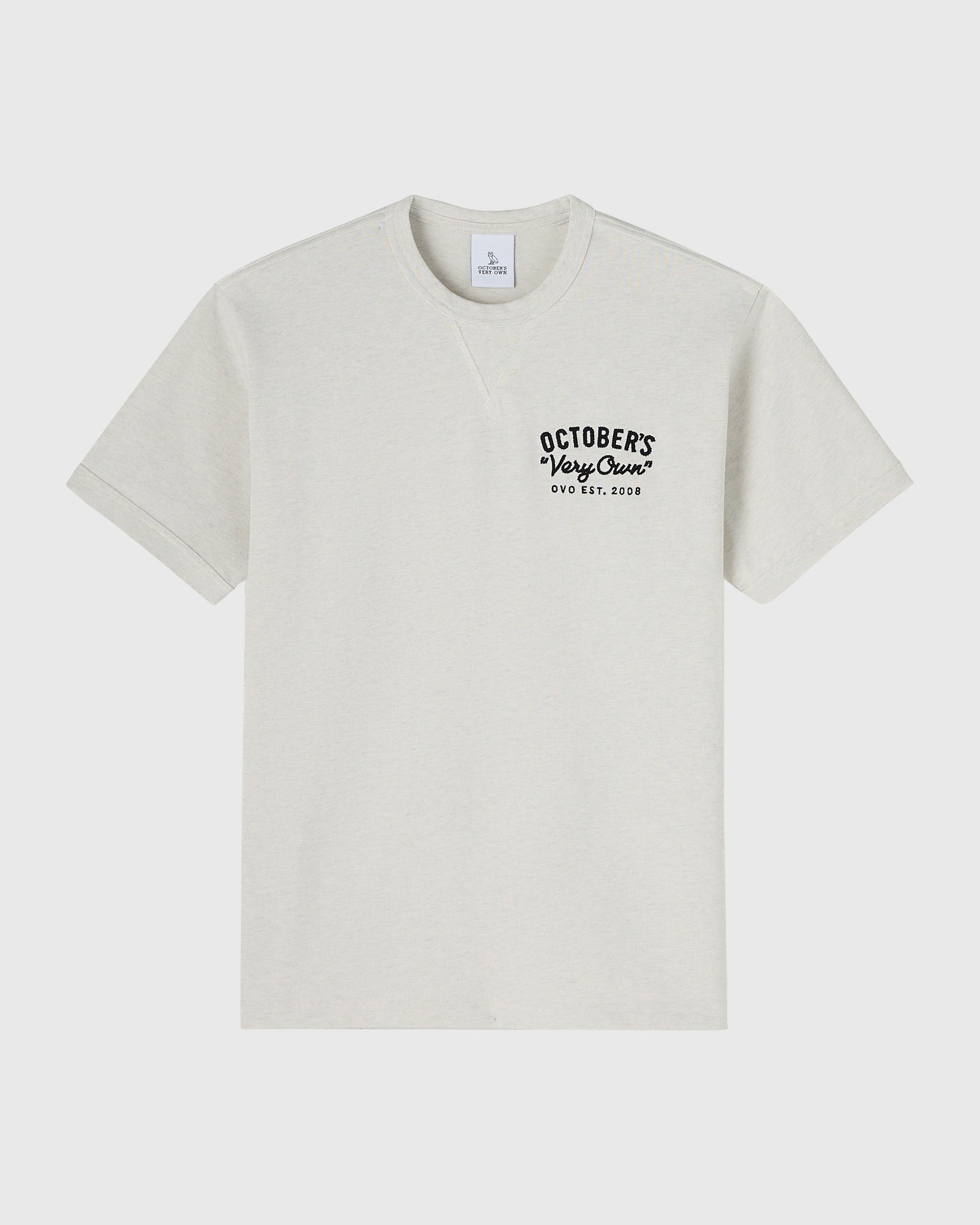 Cream short-sleeve t-shirt with black "October's Very Own" text and "OVO EST. 2008" printed on chest.