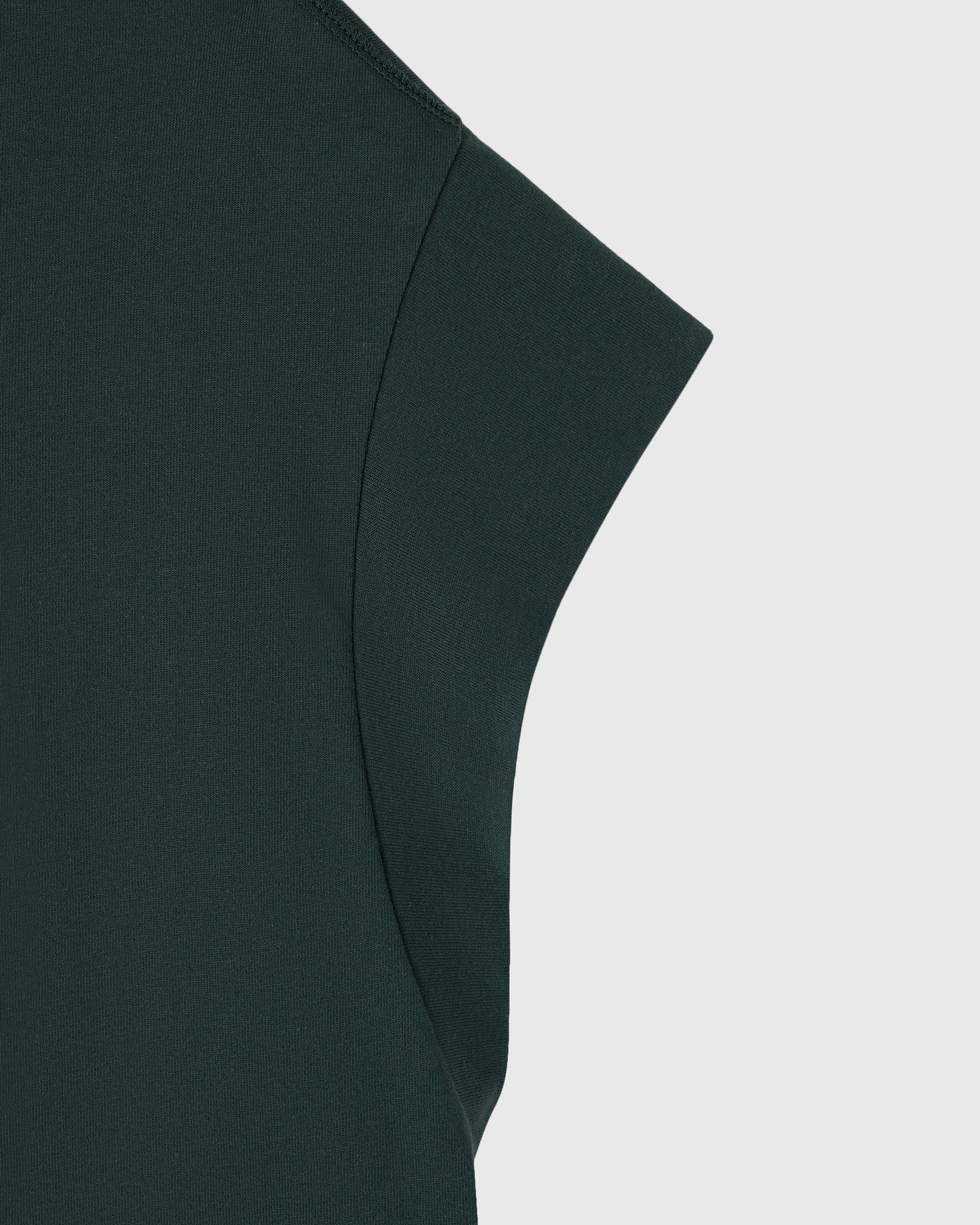 Midnight green muscle tee with ribbed texture and short sleeves, shown in close-up detail.