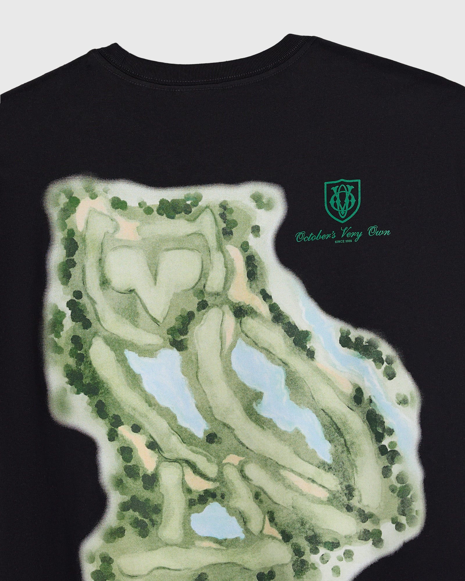 Black crewneck tee with golf course map illustration and OVO owl logo on chest.