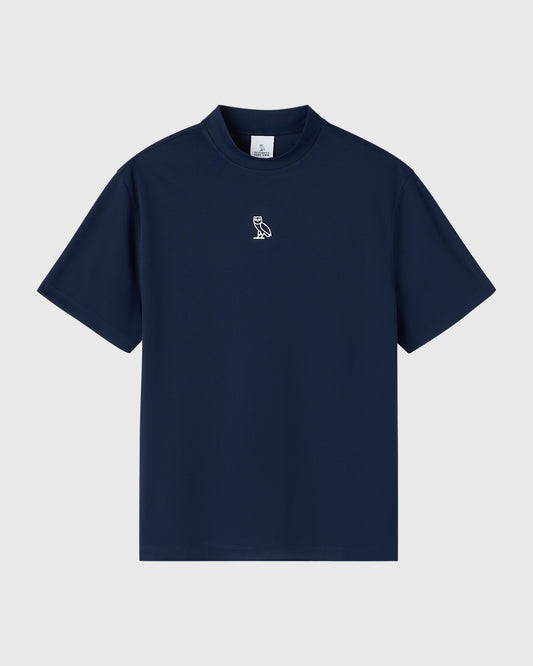 Deep denim short-sleeve mockneck tee with small owl logo on chest.