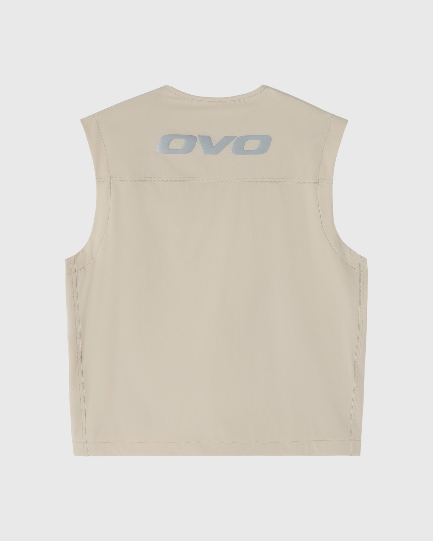 Sandstone sleeveless vest with OVO logo printed on back.