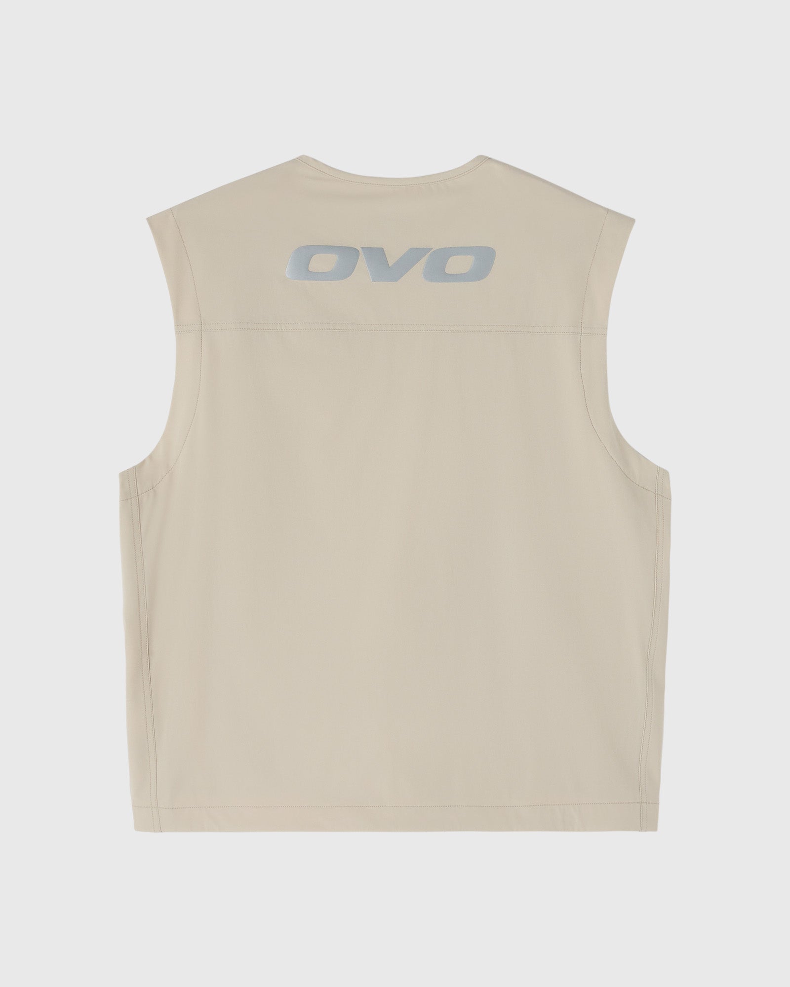 Sandstone sleeveless vest with OVO logo printed on back.