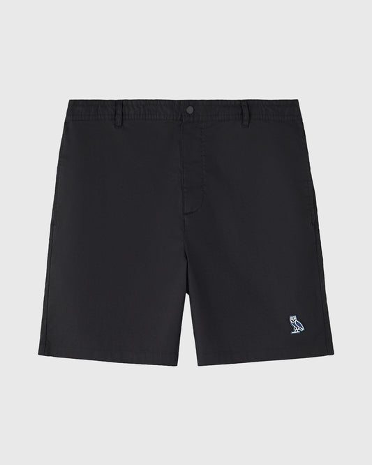 Black shorts with flat front, button closure, side pockets, and small owl logo on leg.