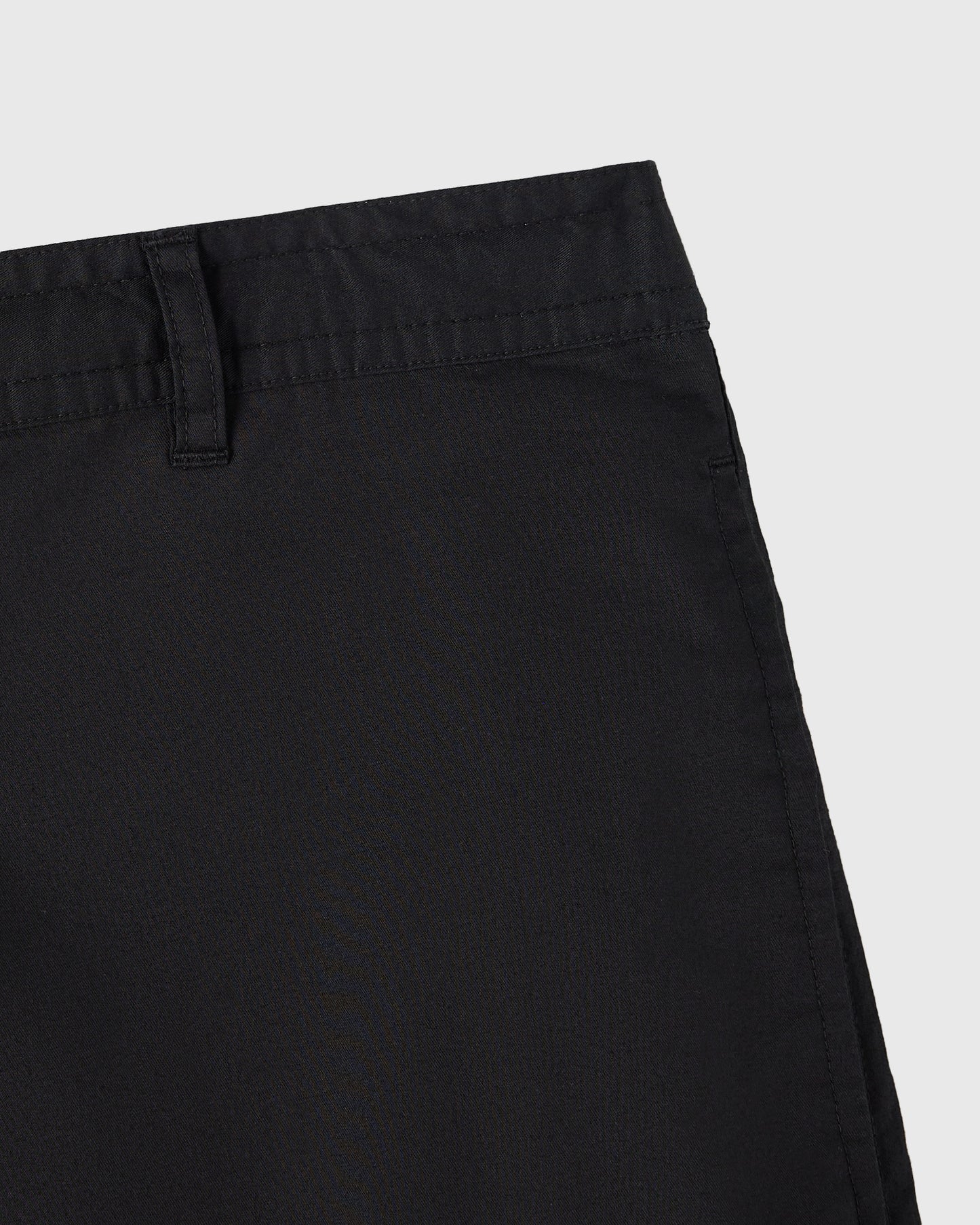 Black camp short showing waistband, belt loop, and stitched seams on solid background.