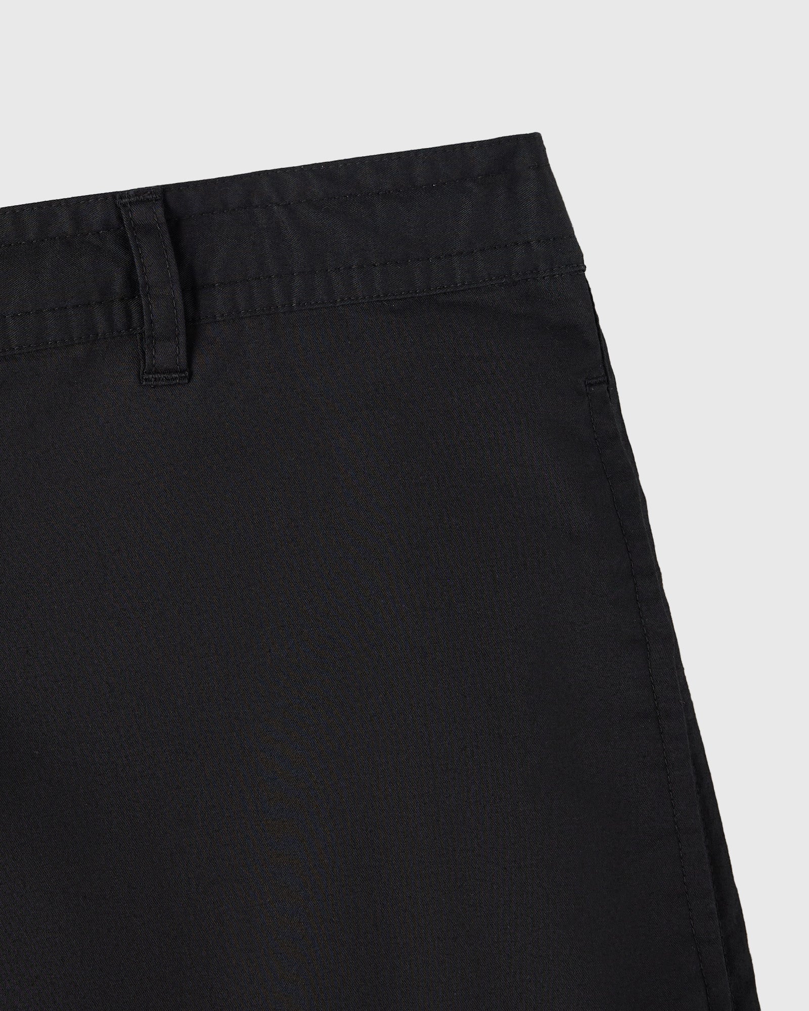 Black camp short showing waistband, belt loop, and stitched seams on solid background.
