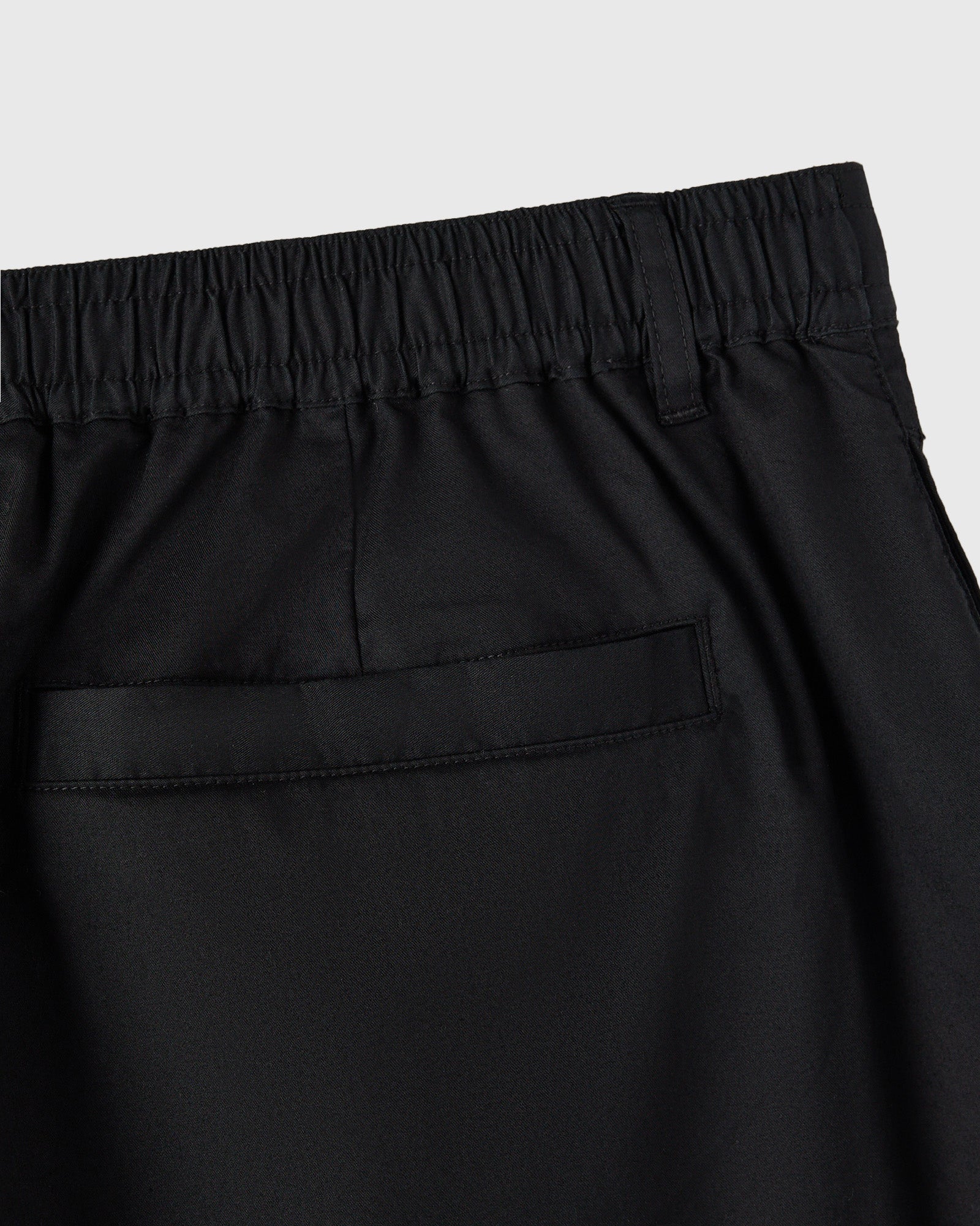 Black shorts with an elastic waistband and back pocket detail.