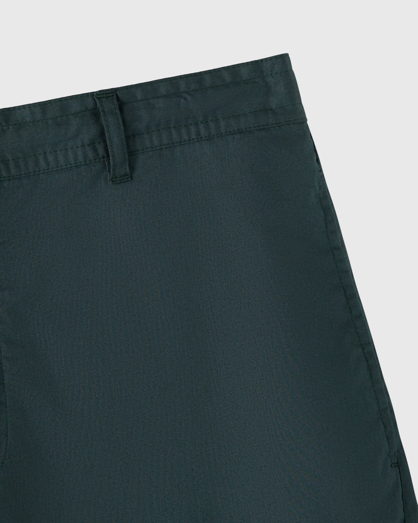 Midnight green camp short with flat front waistband and belt loop detail.