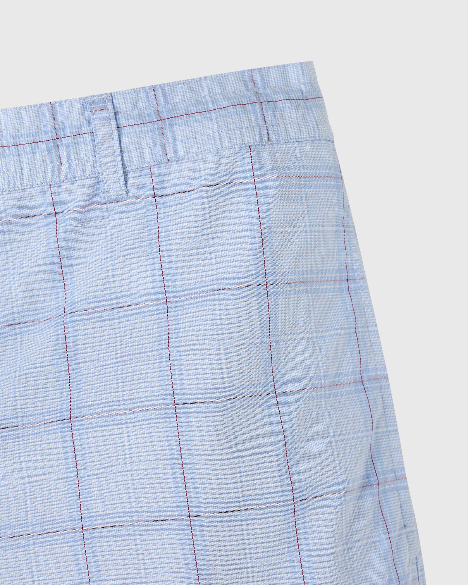 Light blue shorts with red and white plaid pattern, elastic waistband, and front pleats.