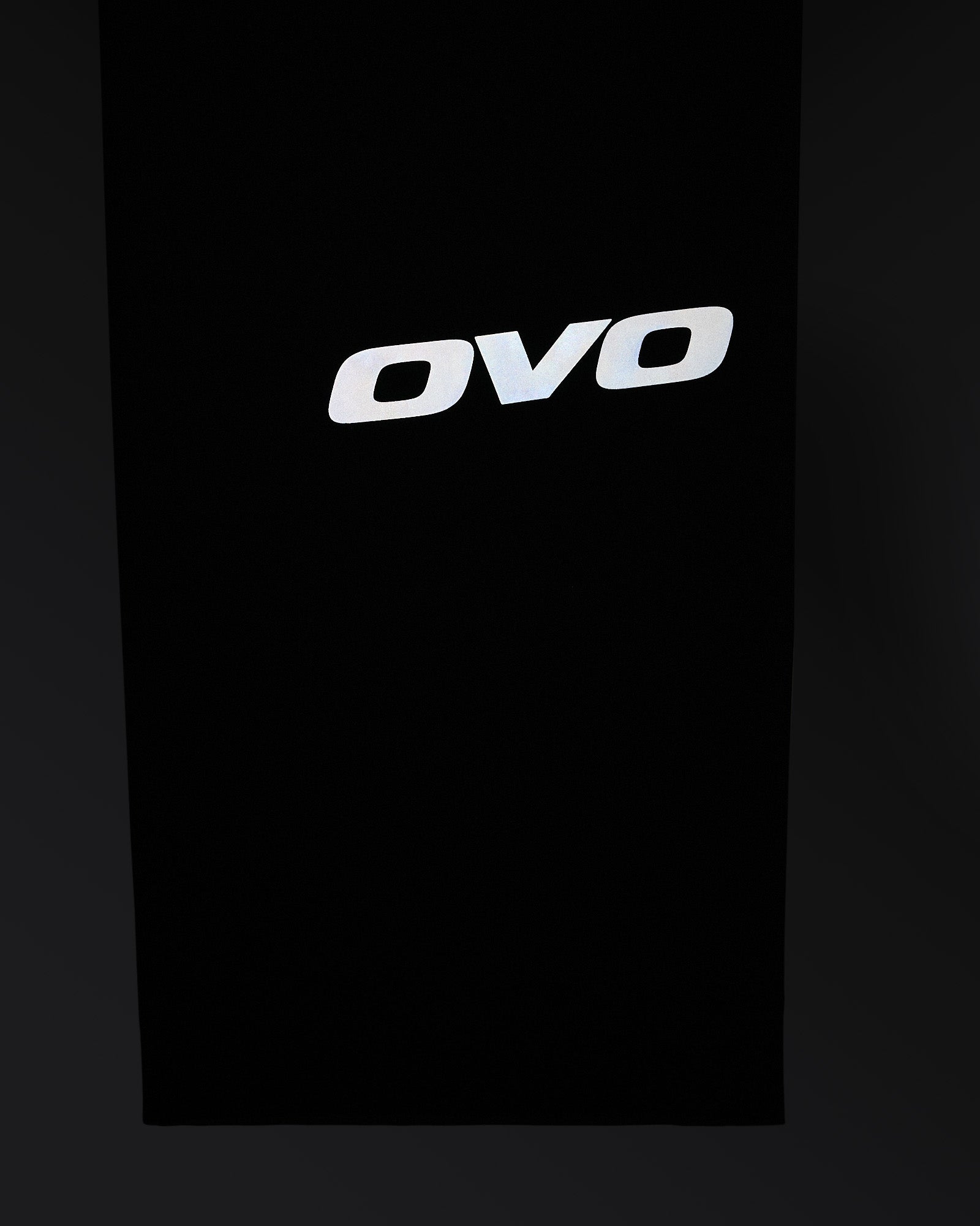 Midnight green stretch nylon chino with white OVO logo printed on front.