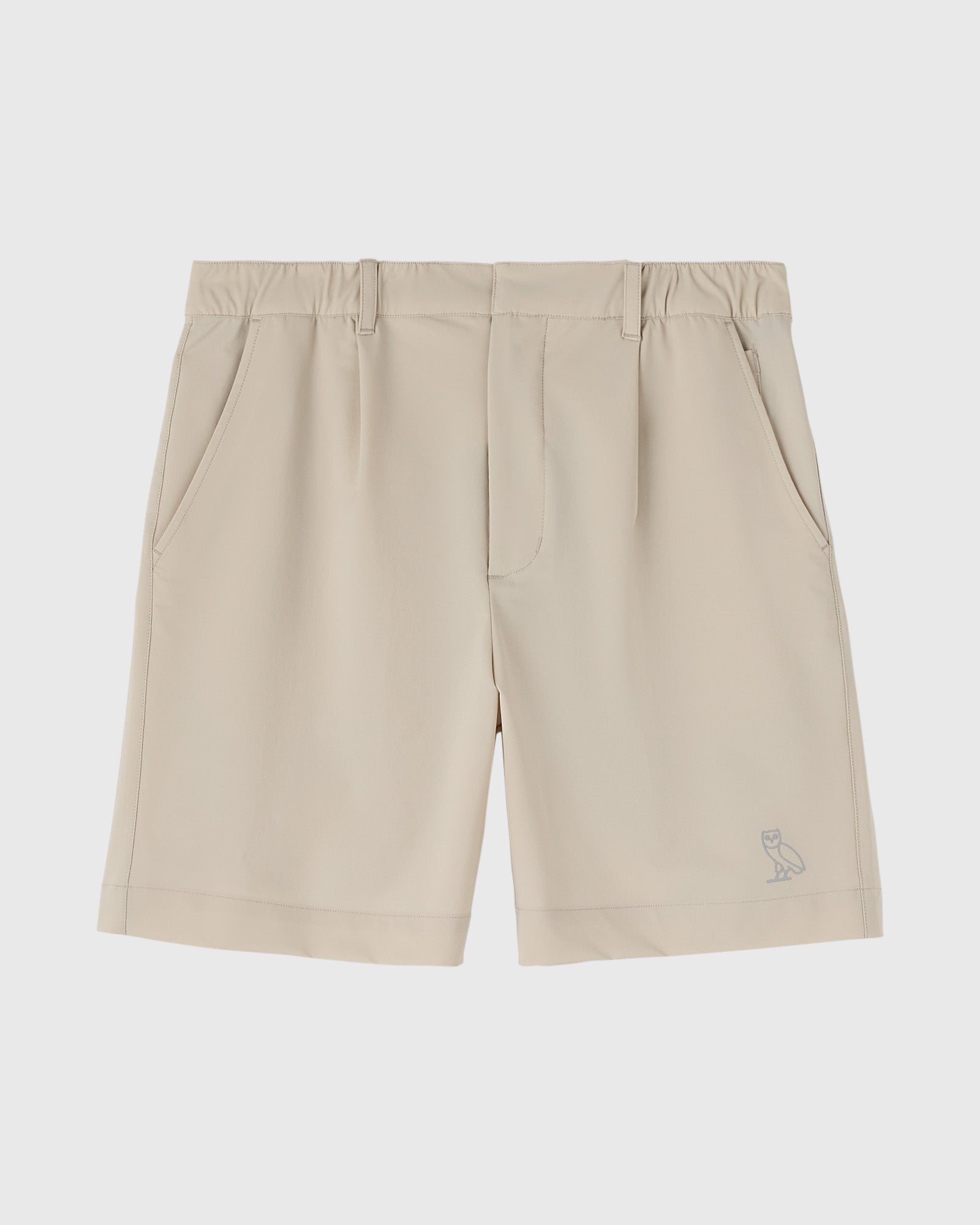 Sandstone stretch nylon golf shorts with front pockets and small owl logo on lower leg.