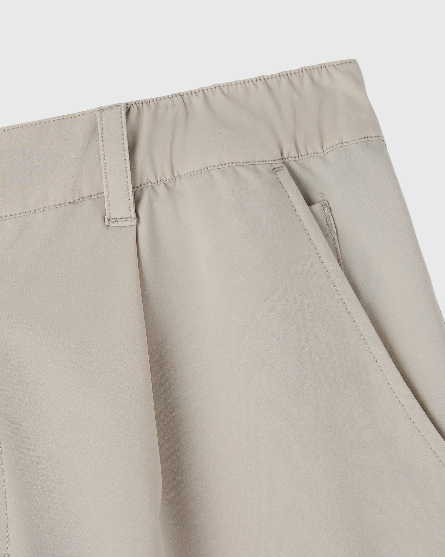 Sandstone golf shorts with flat front, visible waistband, and stitched seams detail.