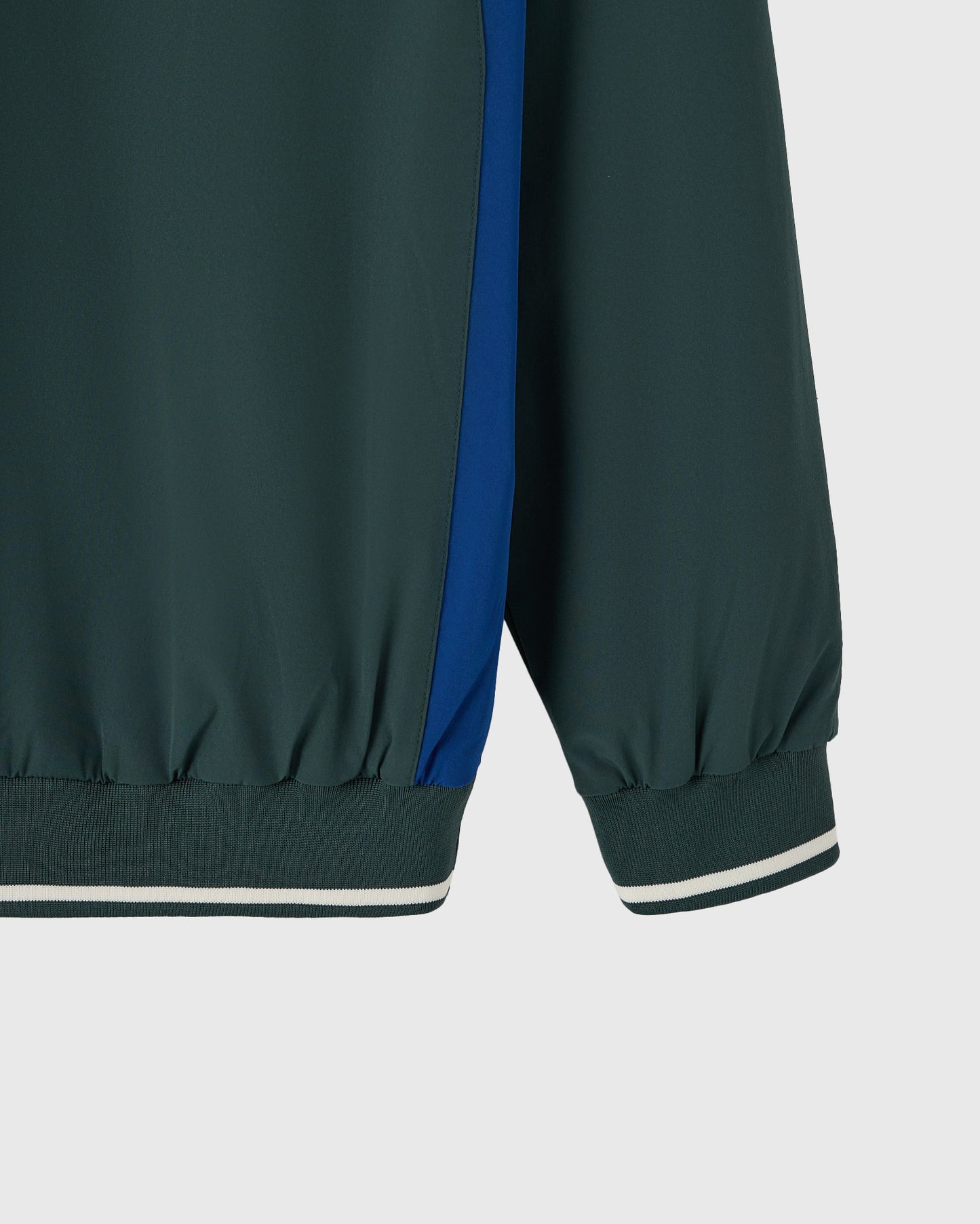 Midnight green pullover with blue side stripe and ribbed cuffs with white trim.