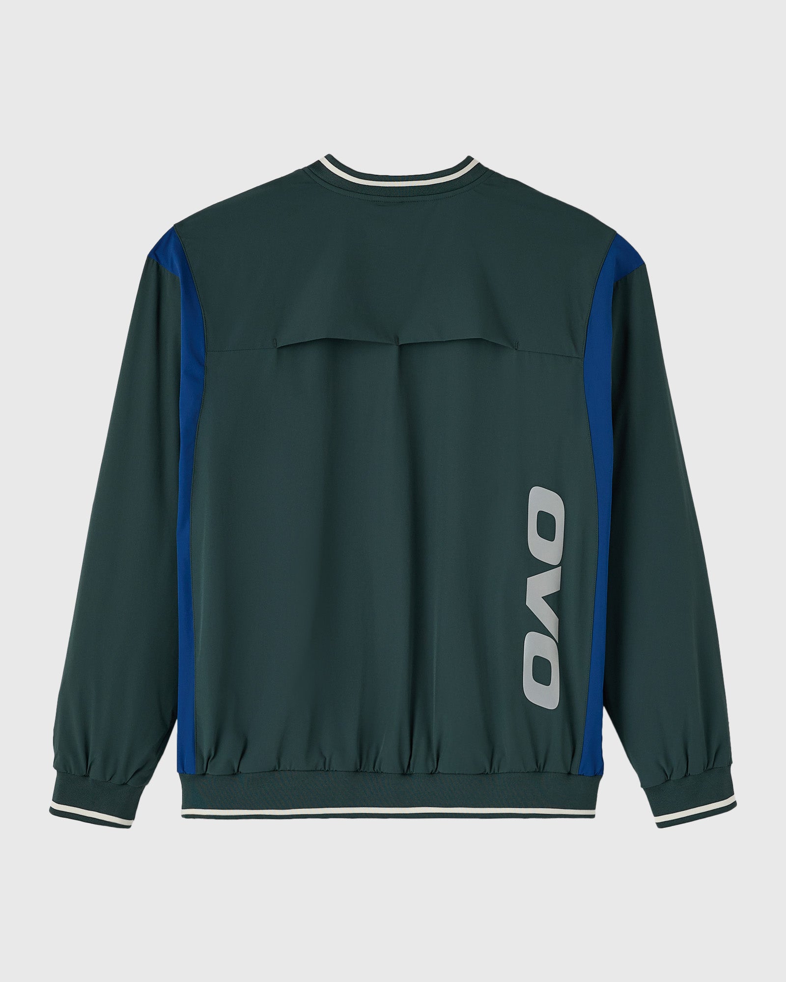 Midnight green pullover with blue side panels, white striping at neckline and cuffs, and OVO logo on back.