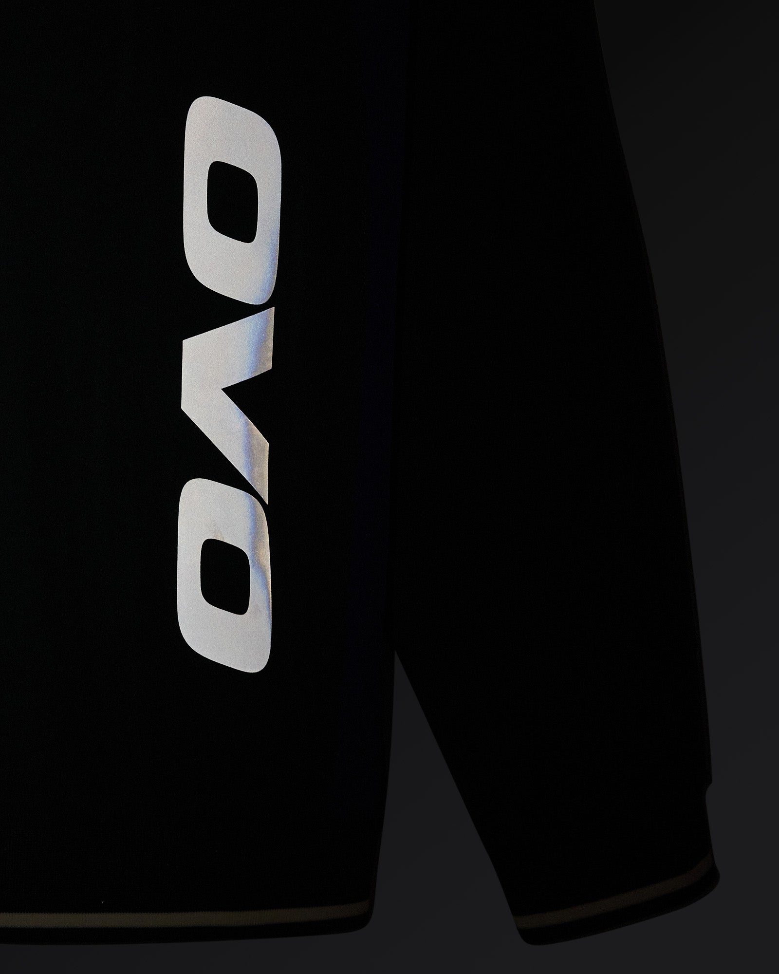 Midnight green stretch nylon pullover with OVO logo on chest and V-neckline.