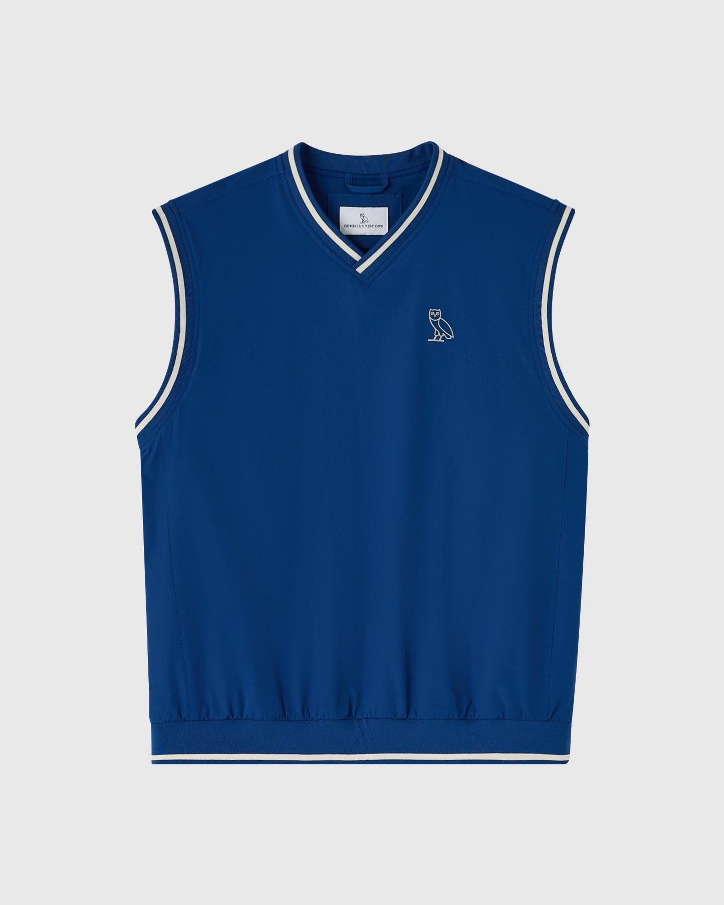Deep denim blue sleeveless pullover vest with white stripe trim and small owl logo on chest.