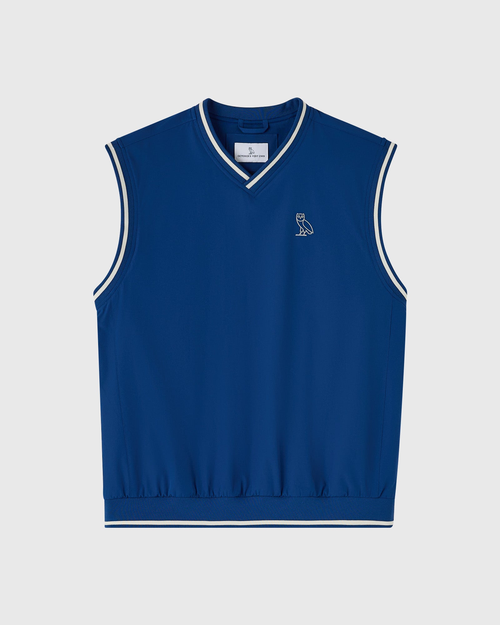 Deep denim blue sleeveless pullover vest with white stripe trim and small owl logo on chest.