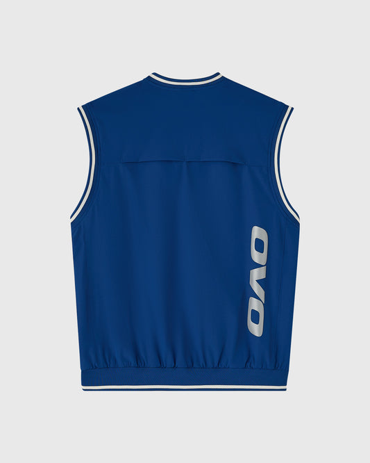 Deep denim pullover vest with white trim and OVO logo on back.