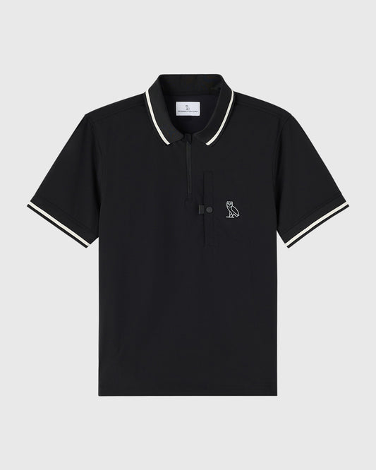 Black polo shirt with white stripe trim on collar and sleeves, featuring small owl embroidery on chest and front placket.