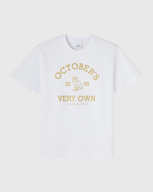 White short-sleeve t-shirt with gold collegiate graphic featuring "October's Very Own" text and owl icon.