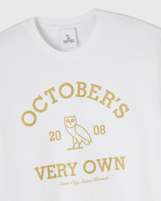 White crew neck t-shirt with gold "Octobers Very Own" text and owl graphic with "2008" underneath.