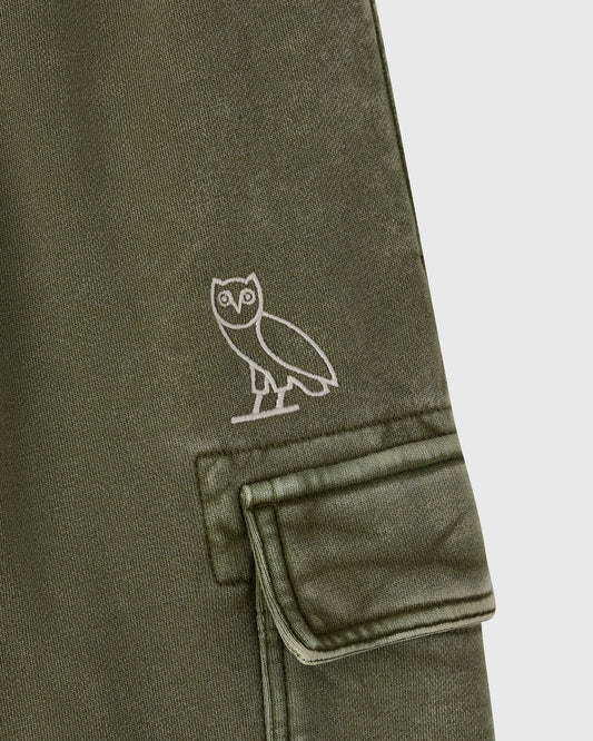 Cypress green cargo sweatpant with white owl embroidery on thigh and a cargo pocket with flap.