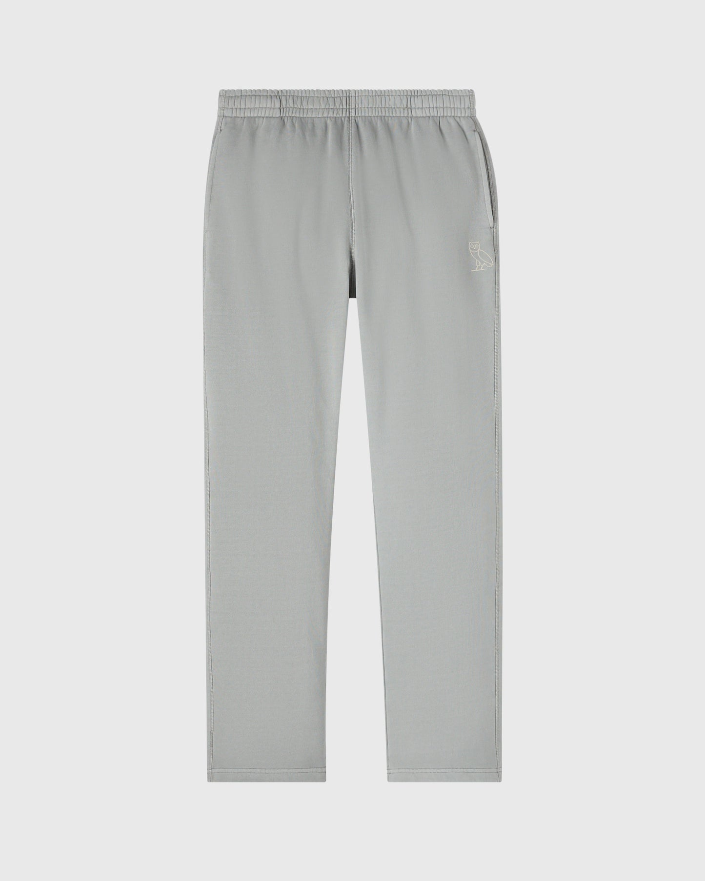 Gray sweatpants with elastic waistband, side seams, open hem, and small embroidered logo on thigh.