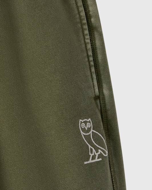 Cypress green sweatpant with white owl embroidery on the leg and drawstring waistband.