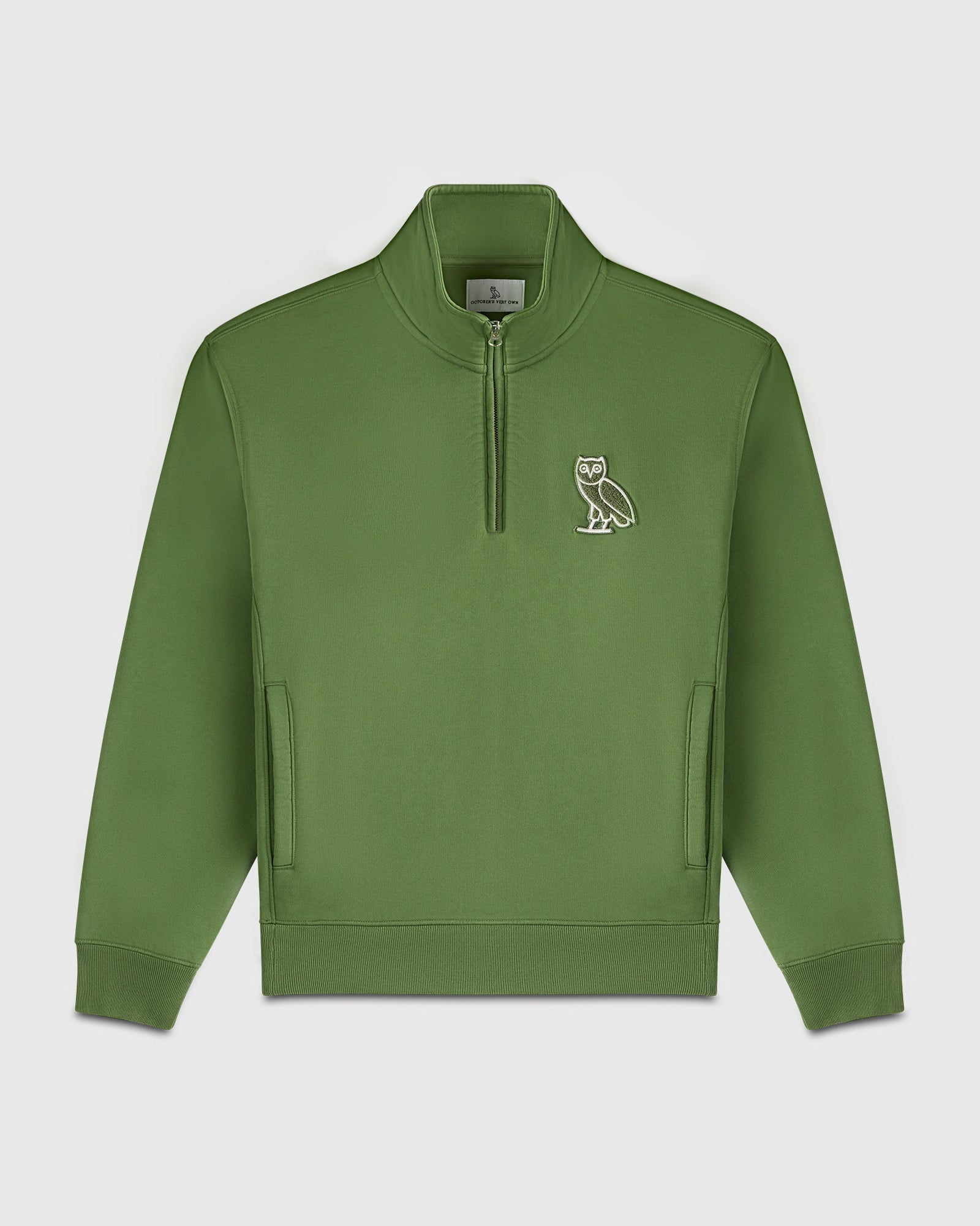 Green quarter-zip mockneck sweatshirt with owl embroidery on chest and front hand pockets.