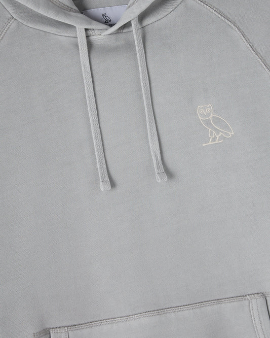 Gray raglan hoodie with white drawstrings and small owl embroidery on chest.