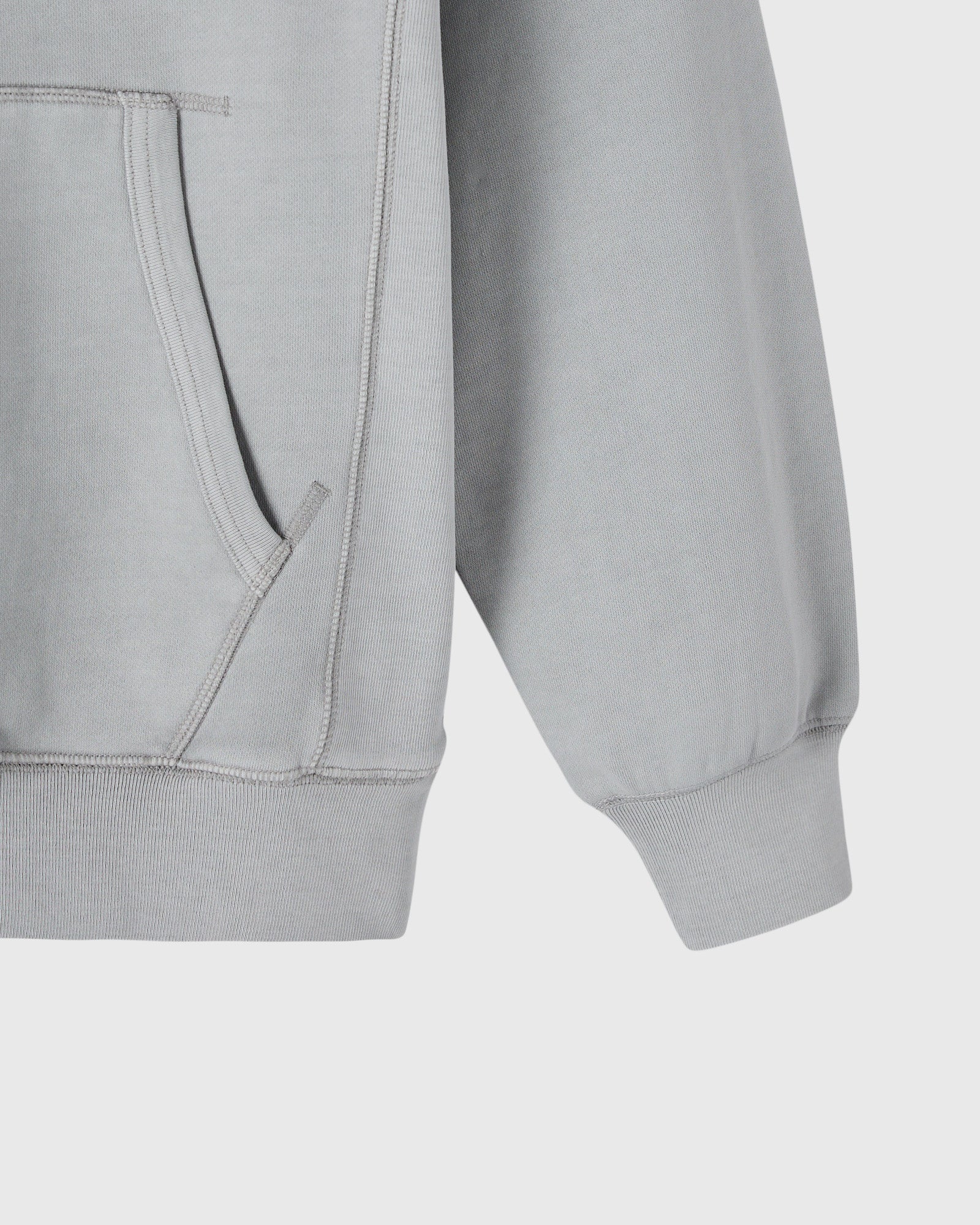 Gray raglan hoodie with ribbed cuffs and kangaroo pocket, front detail view.