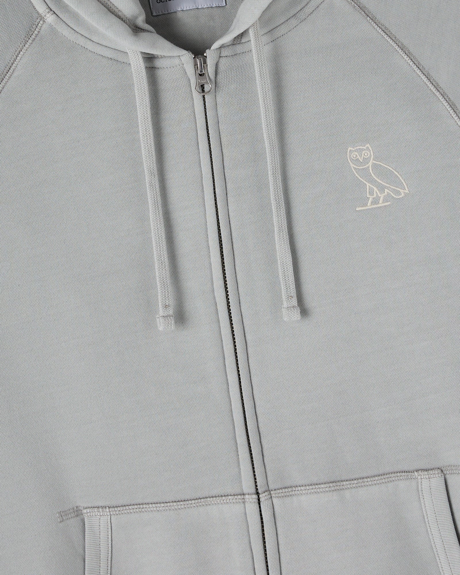 Gray raglan full-zip hoodie with white drawstrings and small owl emblem on chest.