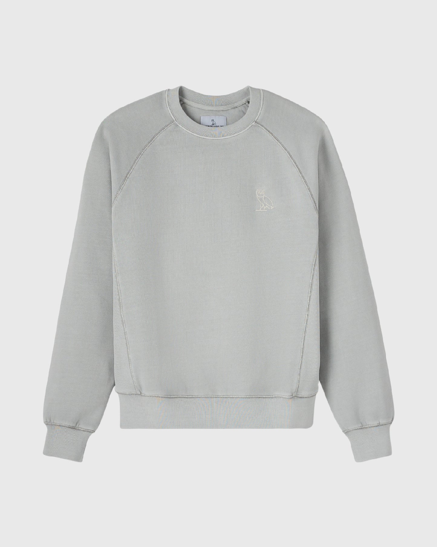 Gray crewneck sweatshirt with raglan sleeves and small embroidered owl logo on chest.