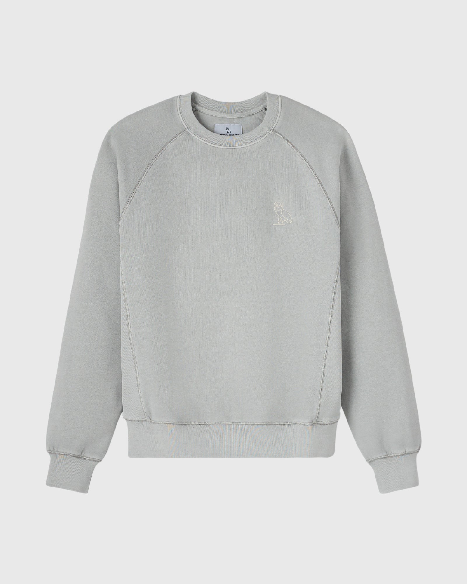 Gray crewneck sweatshirt with raglan sleeves and small embroidered owl logo on chest.