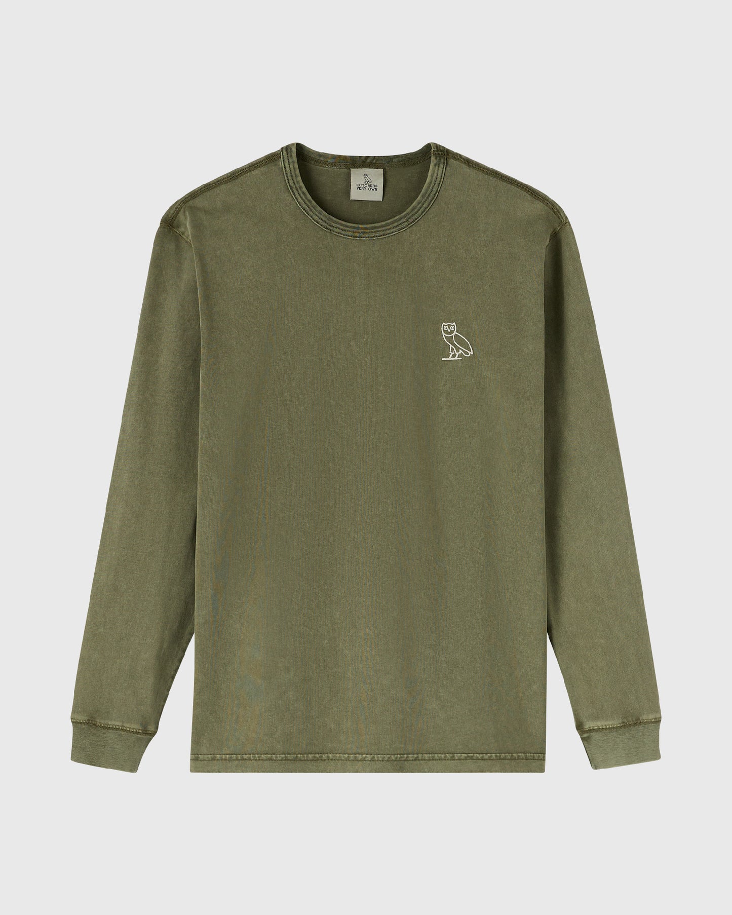 Cypress-colored long-sleeve tee with small owl emblem on chest.
