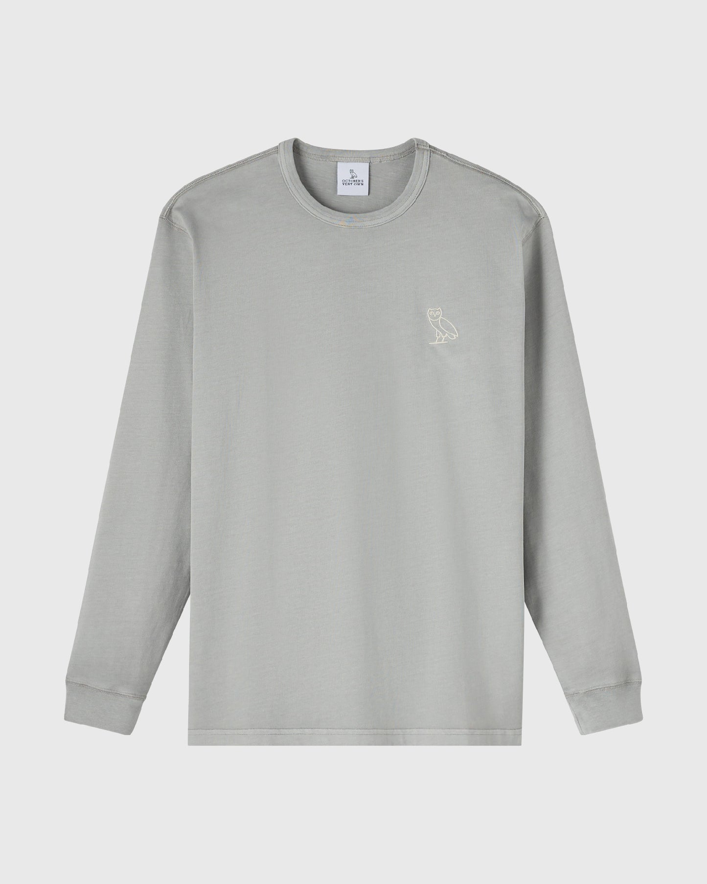 Gray long-sleeve crewneck tee with small owl embroidery on chest.