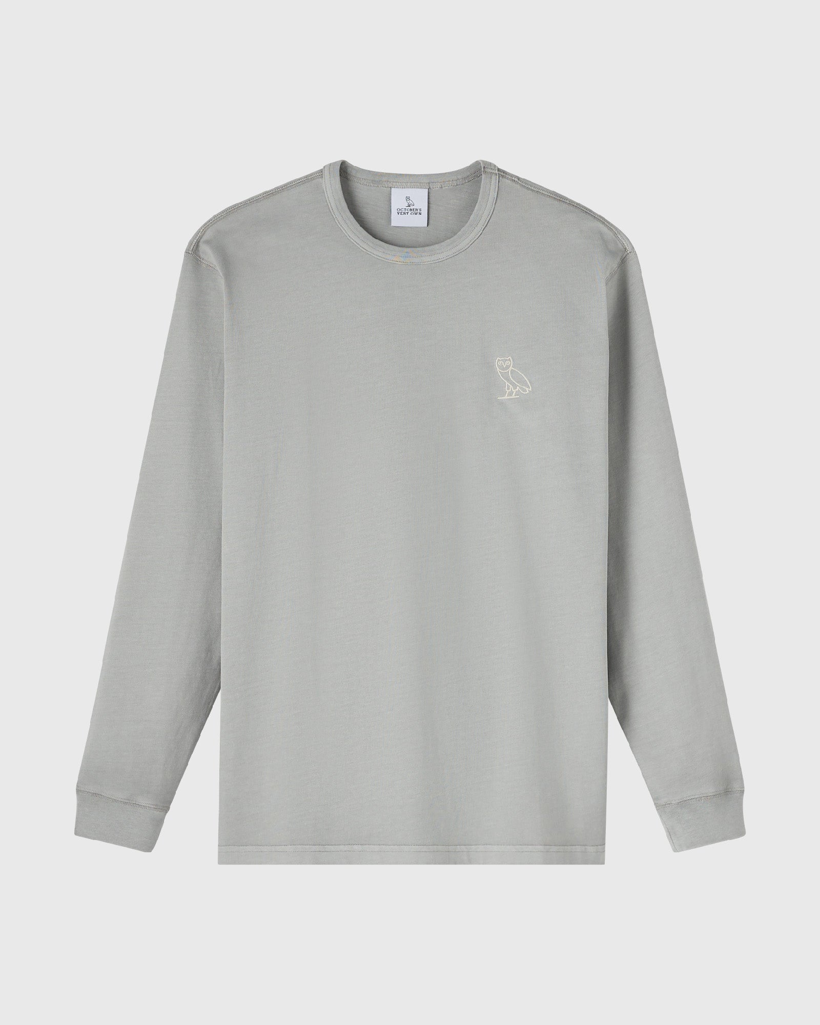 Gray long-sleeve crewneck tee with small owl embroidery on chest.