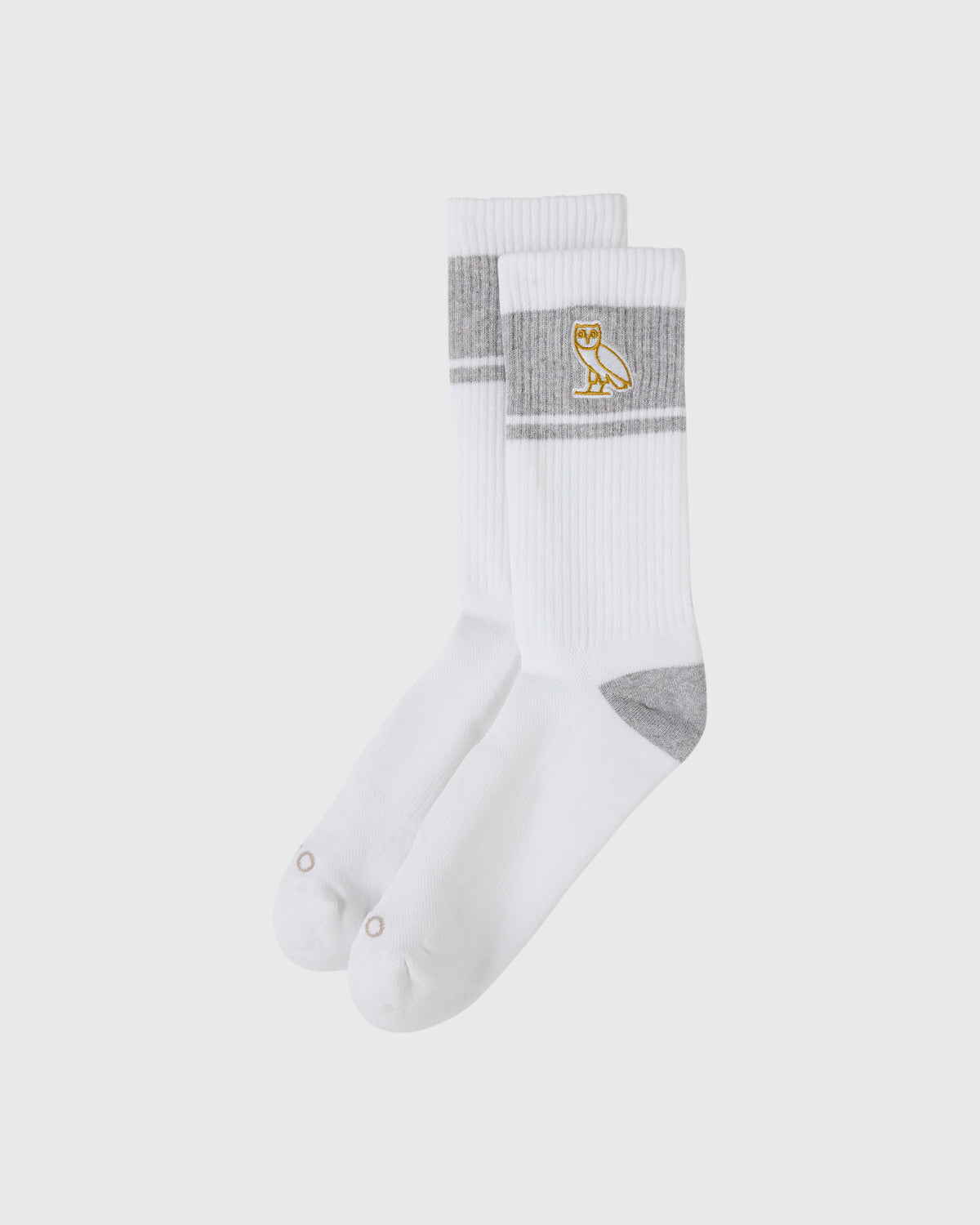 White crew socks with gray stripes, gray heel and toe, and gold owl logo on cuff.