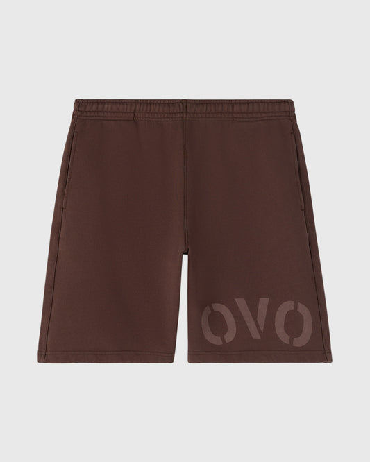 Brown garment dyed sweatshorts with elastic waistband and tonal logo print on right leg.
