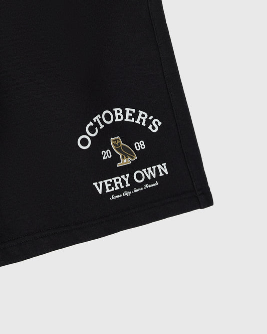 Black shorts with white "October's Very Own" text and owl graphic on the leg.