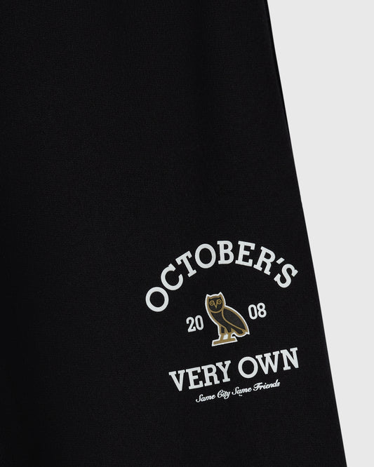 Black sweatpant with "October's Very Own" text, owl graphic, and "Same City Same Friends" script printed on leg.