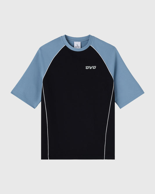 Black and blue raglan training tee with white piping and small logo on chest.