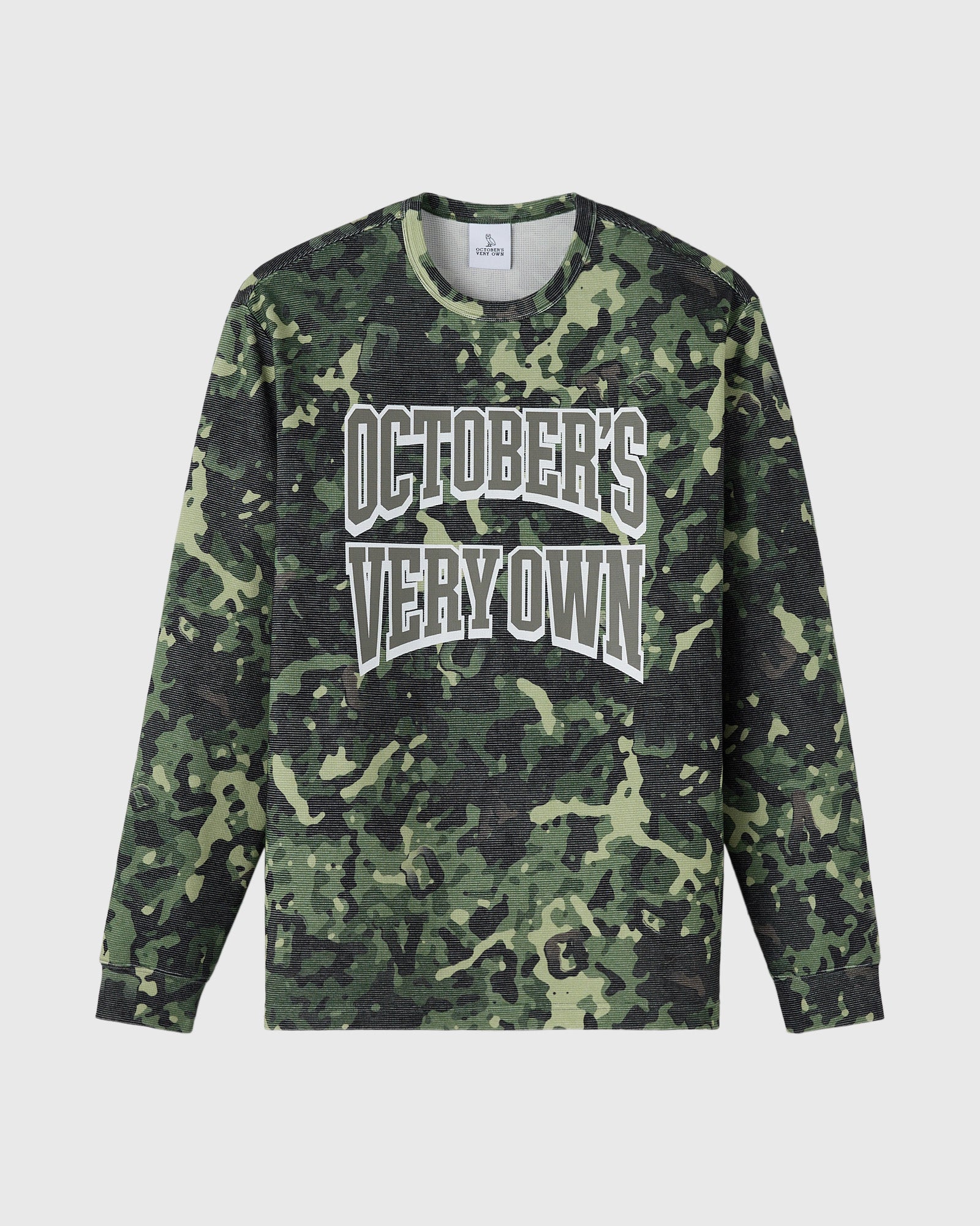Long-sleeve tee in green and black camouflage print with white "October's Very Own" text across chest.